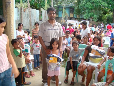 Maxwell Ditta from Orlando USA, witnessing distribution of Uniforms in Manapla School in the Philippines
