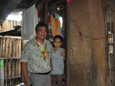 Pr Daniel Catangay from Florida, USA visits his son's sponsored child in his house in the Philippines